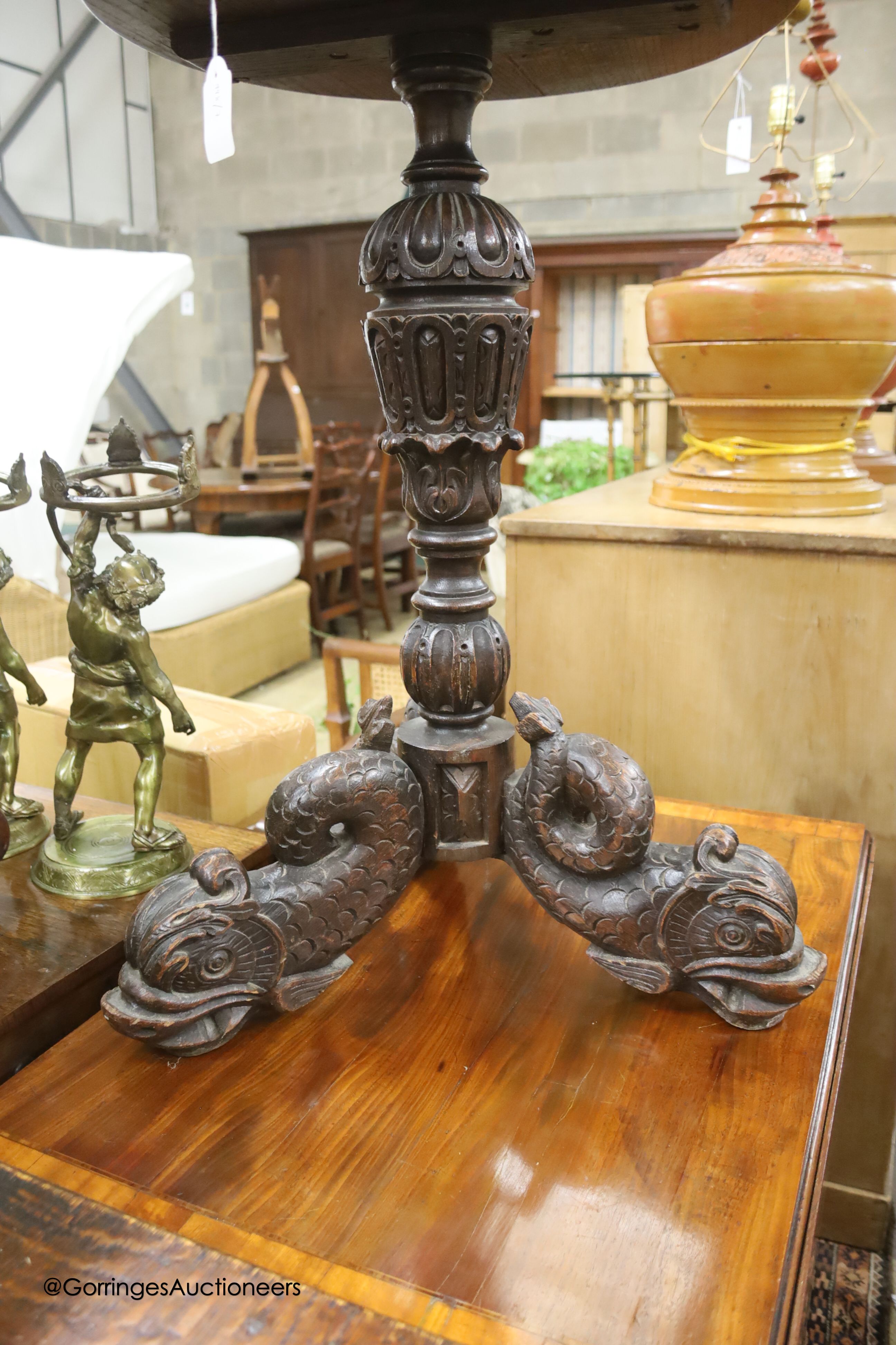 A carved oak and hardwood circular occasional table, diameter 50cm, height 74cm